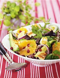 Quinoa salad with avocado, orange, onion, rocket, halloumi