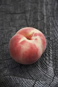 White peach on a tree stump