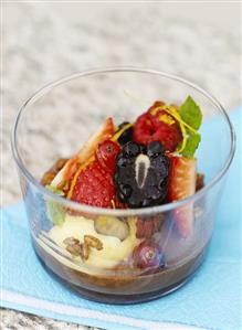 Chocolate cream with fresh berries in a glass