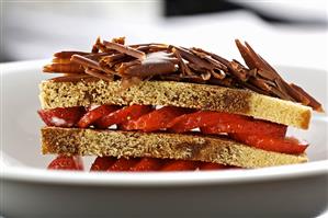 Hazelnut sponge layered with strawberries & chocolate curls