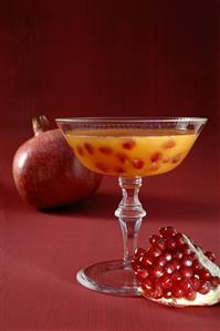 Champagne cocktail with pomegranate seeds