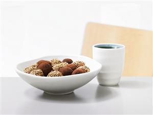 Coffee truffles coated in cocoa and sesame seeds