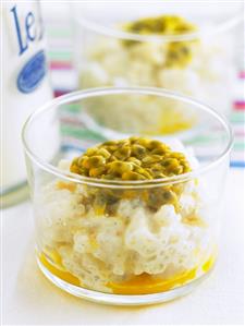 Coconut rice pudding with passion fruit in glasses