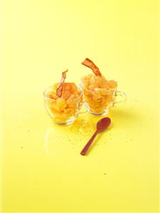 Melon granita with fried ham in two glass cups