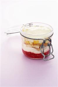 Coconut tiramisu with exotic fruit in a preserving jar