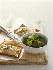 Pear tart with Roquefort and broccoli and bacon salad