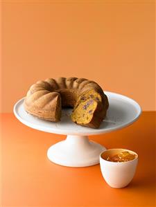 Carrot cake with dates on a cake stand