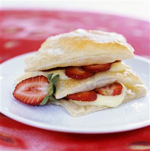 Layered dessert of puff pastry, strawberries and custard