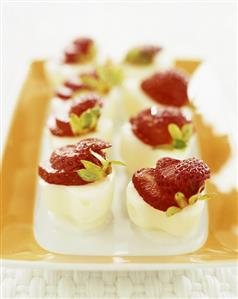 Cubes of lemon sorbet with fresh strawberries