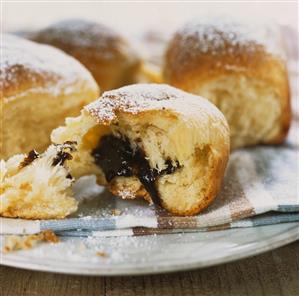 Sweet dumplings with damson filling, dusted with icing sugar