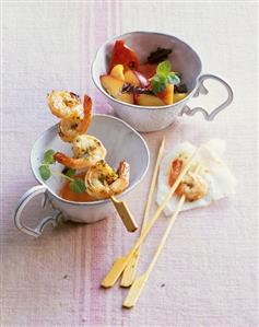 Fried prawn skewers with peach and tomato salad