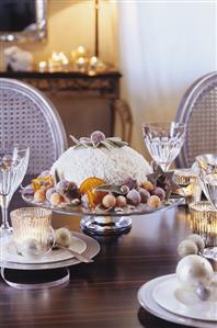 Chocolate and orange dome cake on festive table