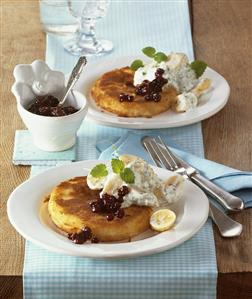 Breaded melon slice with banana salad and cranberries