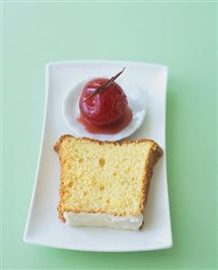 A slice of angel food cake with spiced plum