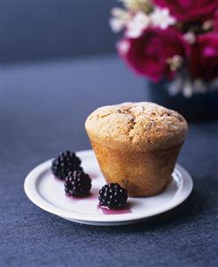 Small chocolate whisky cake with blackberry compote