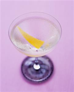 A glass of Martini with lemon