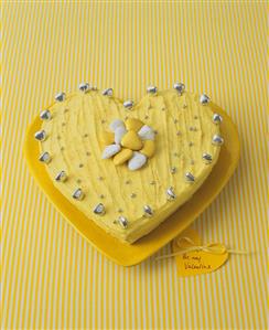 Yellow heart-shaped cake for Valentine's Day