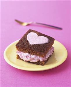 Ginger cake with rhubarb fool filling and sugar heart