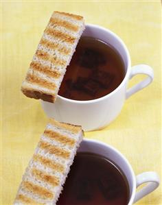 Clear oxtail soup with fingers of toast