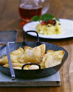 Potato turnovers with apple and onion filling