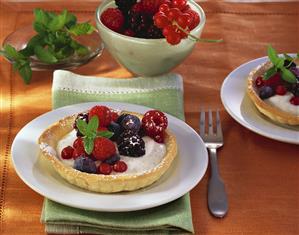 Mixed berry tarts with vanilla cream