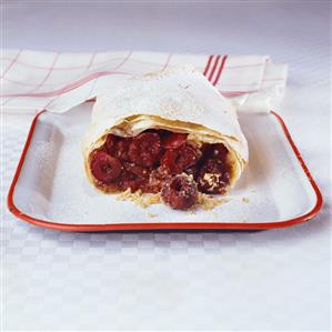 Cherry strudel, a portion taken