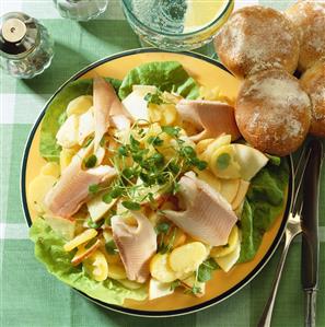 Warm potato salad with trout fillets