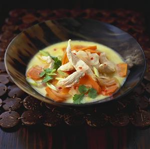 Coconut and chicken soup with vegetables