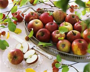 Still life with apples on tray and glass plate