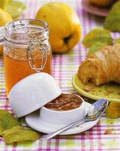 Quince jelly in preserving jar and jam dish