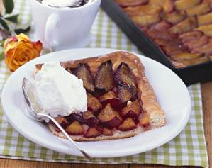 Zwetschgendatschi (damson cake) with cream