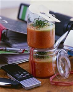 Lunch break: gazpacho with basil in plastic tubs