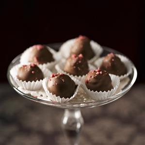 Raspberry truffles on stand