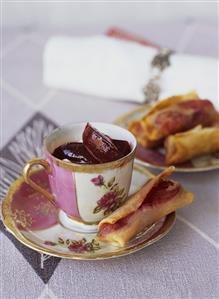 Soft cheese cream with plums and plum spring rolls