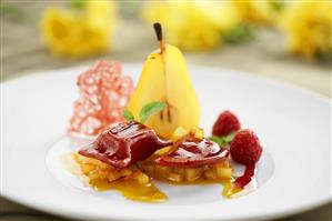 Saffron pear with raspberry ravioli