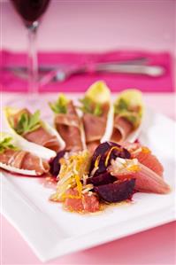 Ham in chicory with rhubarb, beetroot and grapefruit salad