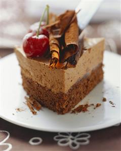 Piece of chocolate cake with cherries