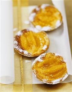 Three orange and walnut tarts