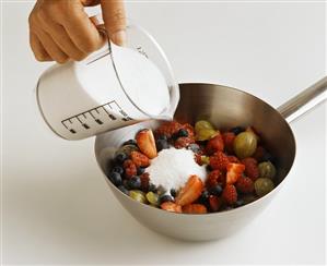 Fruit and jam sugar in a pan for jam-making