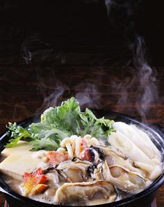 Japanese stew with oysters, tofu, edible chrysanthemums etc.