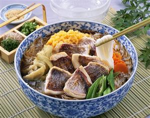 Japanese noodle dish with sea bream, scrambled egg & vegetables