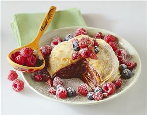 Pancake cake filled with berry jam