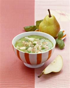 Pea cream soup with lobster and pear