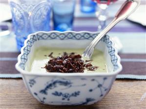 Broad bean soup with strips of fried bacon