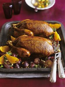 Duck with oranges and red onions in rosemary & honey sauce