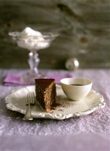 A piece of chocolate cake with chocolate sauce