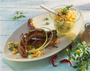 Sausages with mango and chilli salad