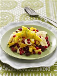 Mango, banana, orange & grape salad with pomegranate seeds