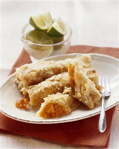 Sweet papaya-filled cannelloni with coconut flakes