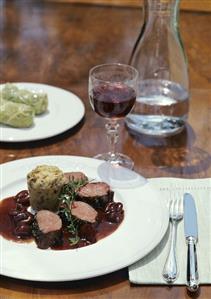 Loin of venison with cherry sauce and mushroom dumpling